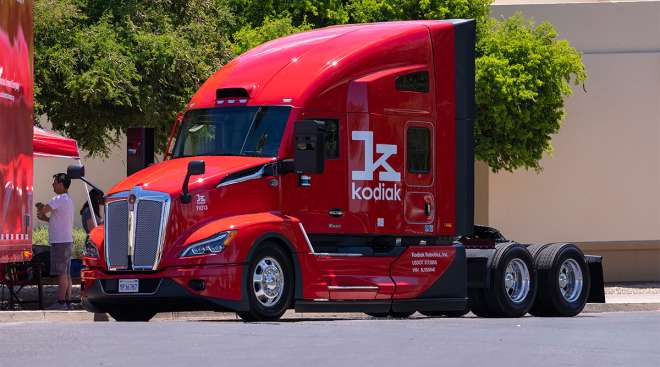 A Kodiak Robotics tractor sits parked on a road.