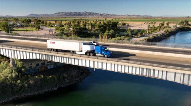 A tractor-trailer connected to a Revoy EV